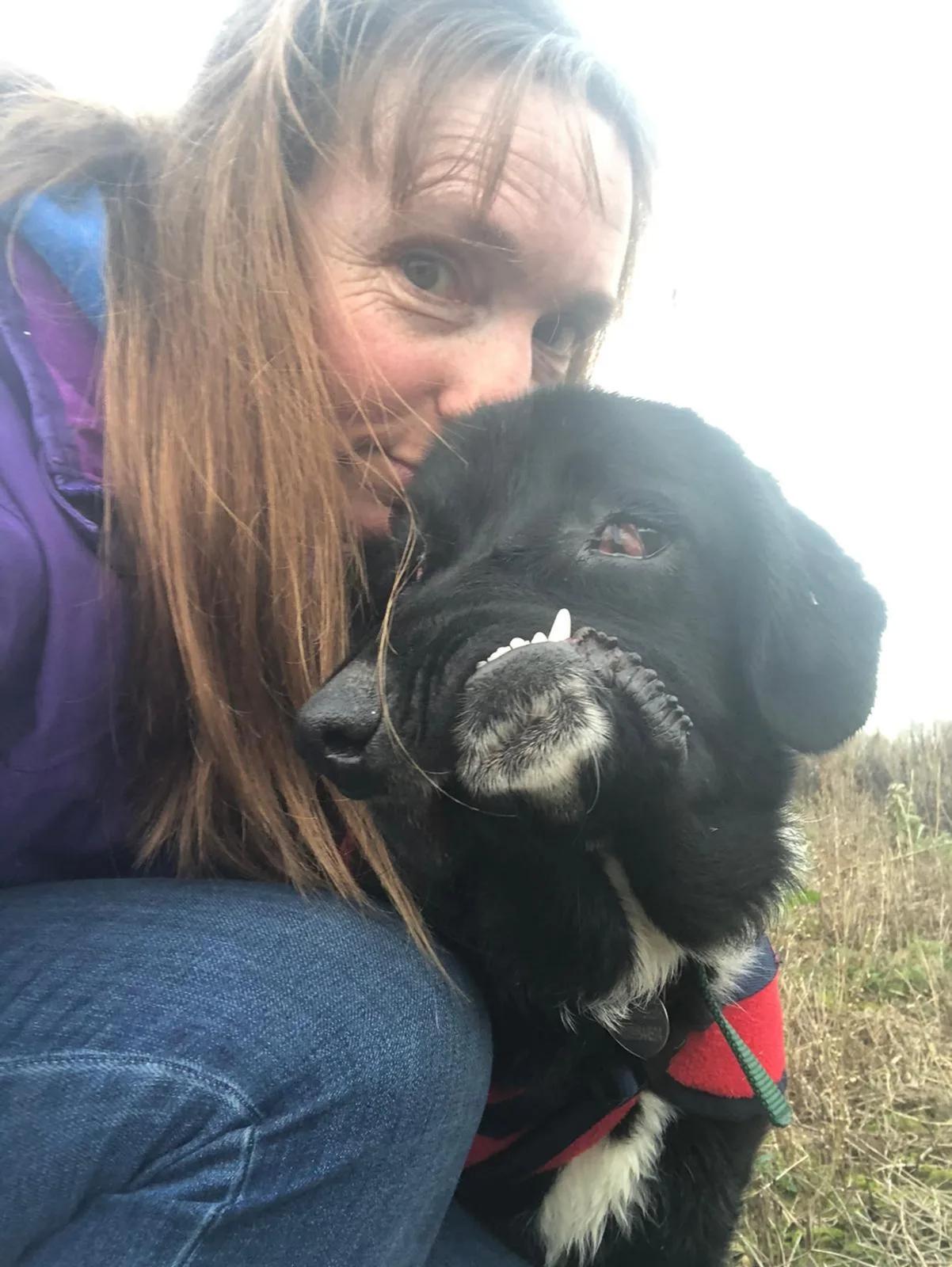 Foster carer Zoe Casey sitting with Bethany, the gentle puppy waiting for a forever home in Norwich